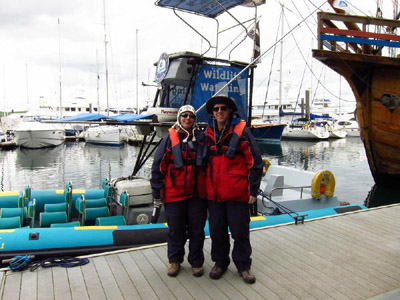 Lucy and Stephen by the Orca Sea Safaris boat in Falmouth harbour