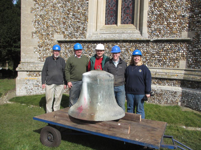 Some of the Woolpit bellringers with the tenor bell